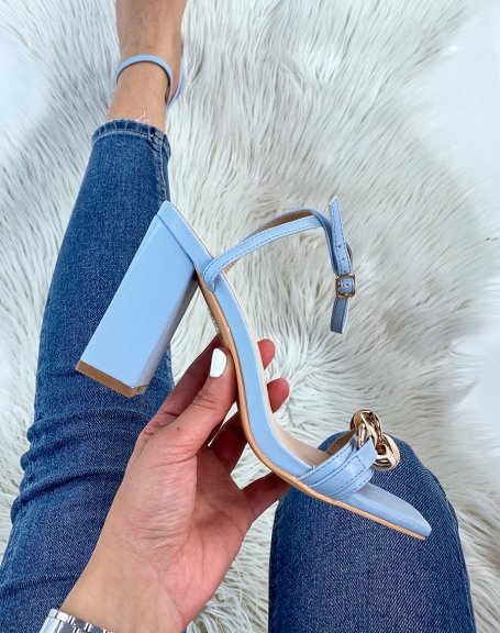 Baby blue heeled sandals with thin straps and gold chain