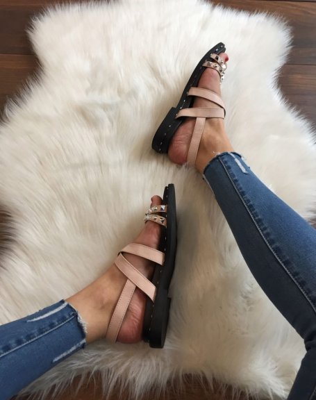 Bare feet with pink studded straps