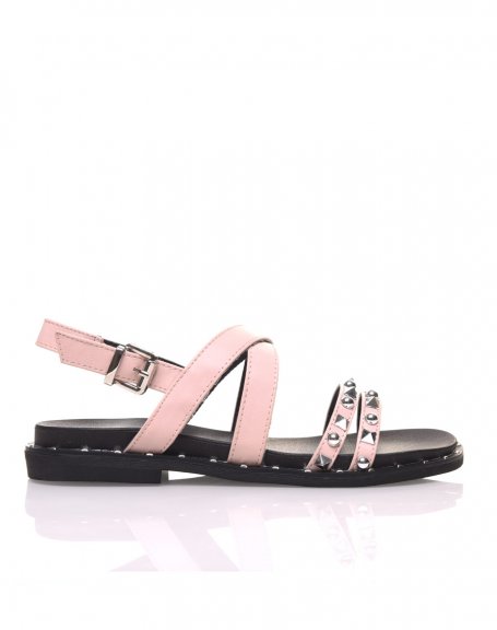 Bare feet with pink studded straps