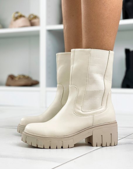 Beige ankle boots with notched sole