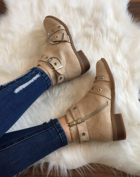 Beige ankle boots with studded straps open at the front