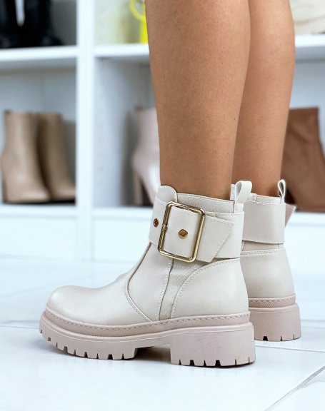 Beige ankle boots with thick and golden strap