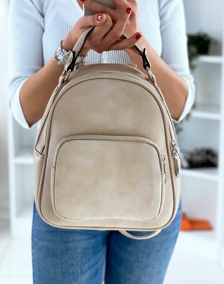 Beige backpack with silver zips