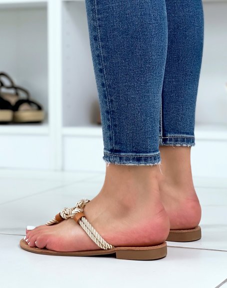 Beige barefoot with braided rope straps and gold ring