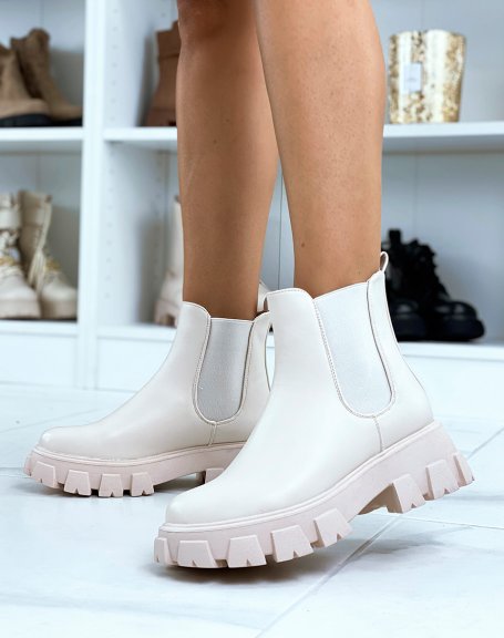 Beige Chelsea boots with large, thick, lugged sole
