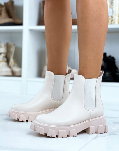 Beige Chelsea boots with large, thick, lugged sole