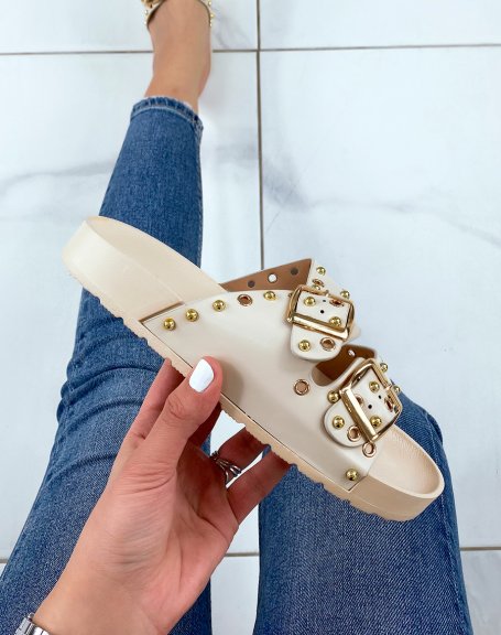 Beige flat mules with adjustable straps and gold studs