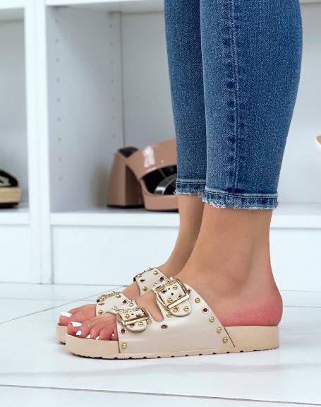 Beige flat mules with adjustable straps and gold studs