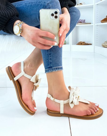 Beige flat sandals with bow and small pearl