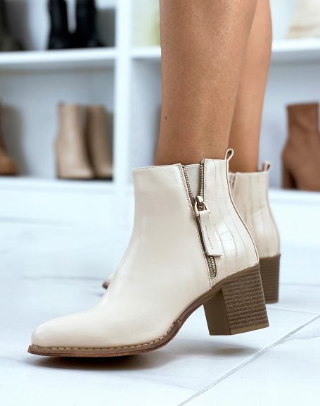 Beige heeled ankle boots with crocodile detail