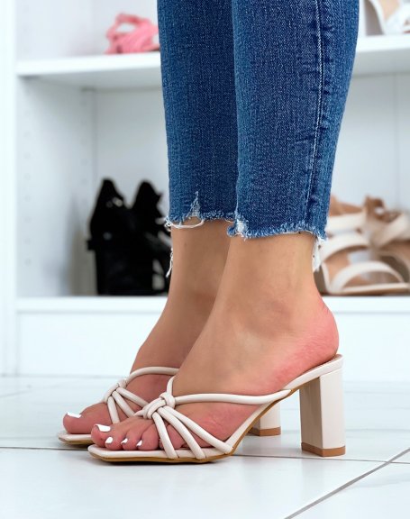 Beige heeled mules with criss-cross straps