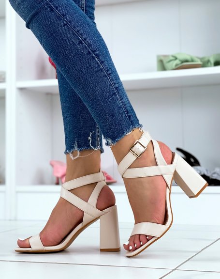Beige heeled sandals with criss-cross straps