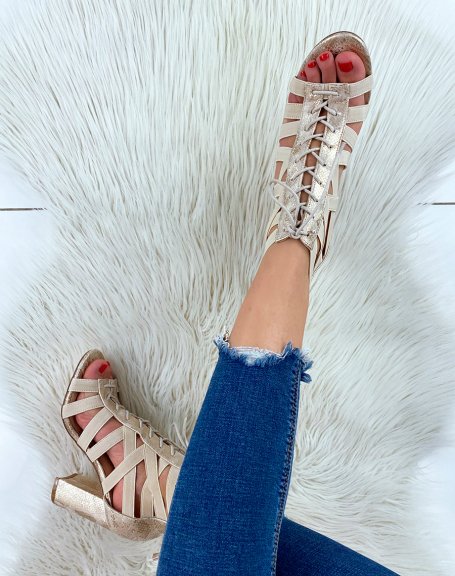 Beige heeled sandals with multiple straps and laces