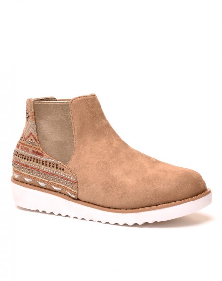 Beige high top sneakers with Aztec patterns