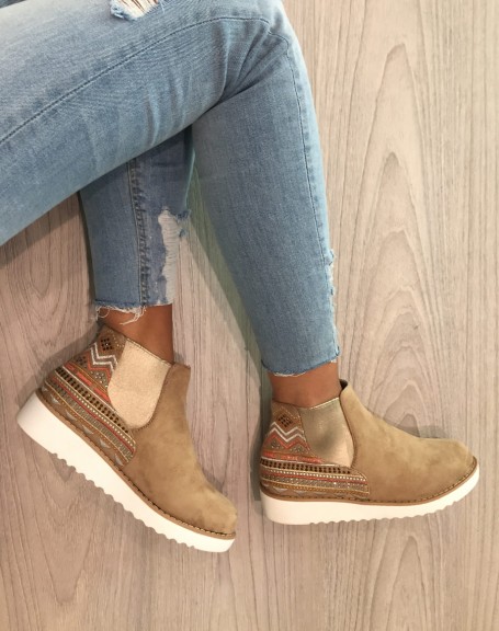 Beige high top sneakers with Aztec patterns
