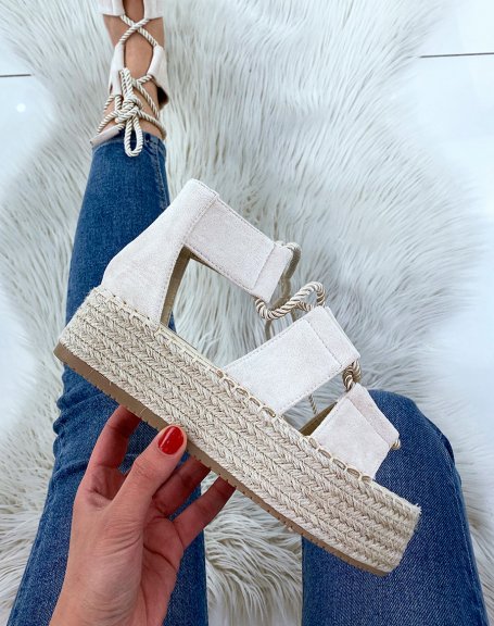 Beige lace-up wedges and hessian sole