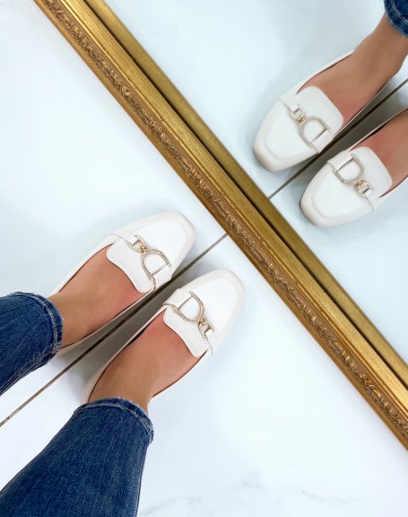 Beige loafers with asymmetrical golden rhinestone buckles