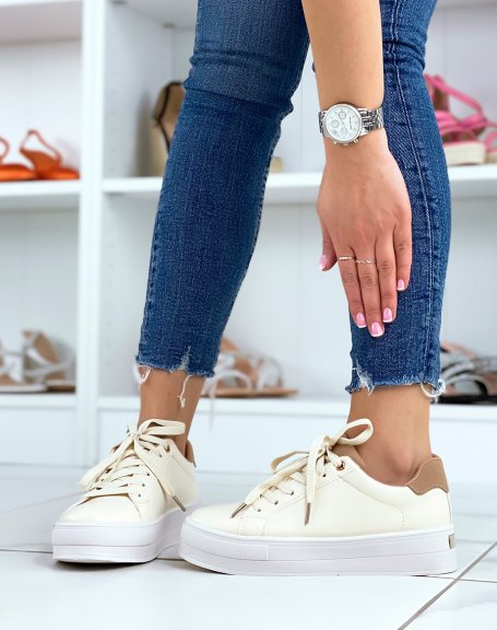 Beige low-top sneakers with brown yoke and thick sole