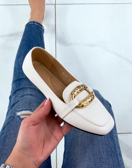 Beige moccasins with large imposing golden buckle