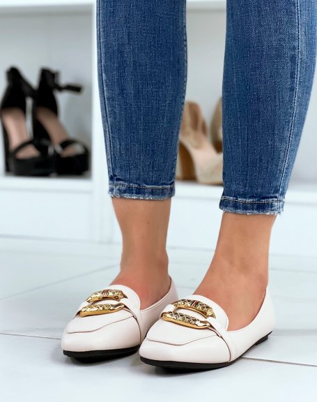 Beige moccasins with large imposing golden buckle