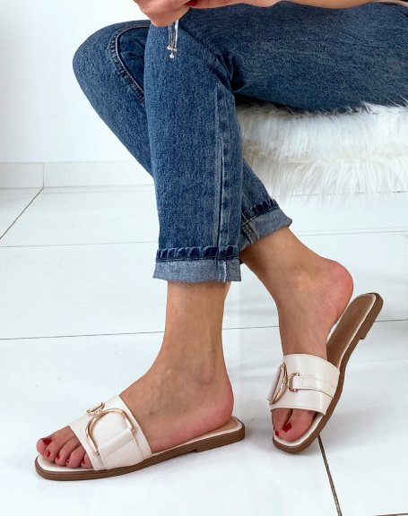 Beige mules with chunky buckles