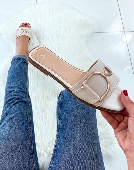 Beige mules with chunky buckles
