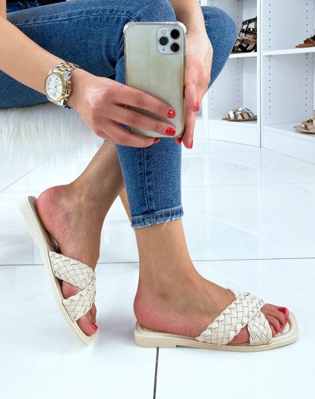 Beige mules with crossed and braided straps