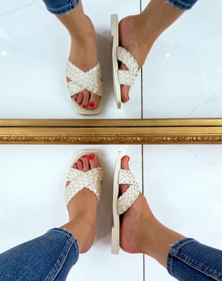 Beige mules with crossed and braided straps
