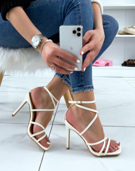 Beige patent sandals with criss-cross straps and stiletto heel