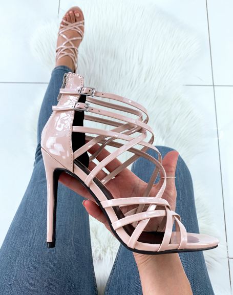 Beige patent sandals with multiple crisscrossed straps and stiletto heels