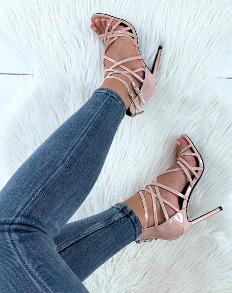 Beige patent sandals with multiple crisscrossed straps and stiletto heels