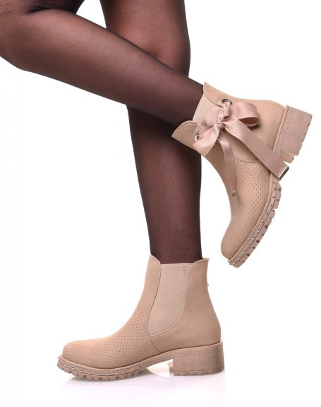 Beige perforated ankle boots with notched soles