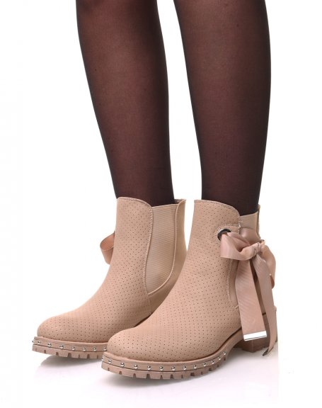 Beige perforated ankle boots with notched soles