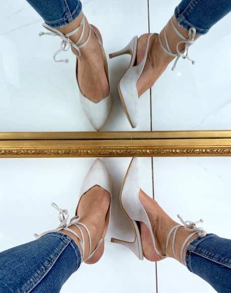 Beige pumps open at the back with long straps