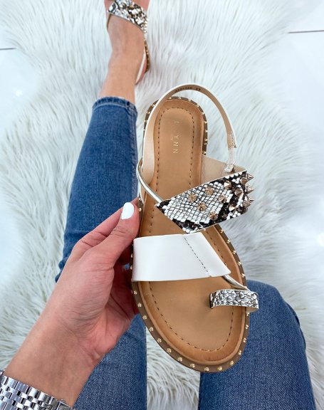 Beige sandals and snake effect adorned with studs