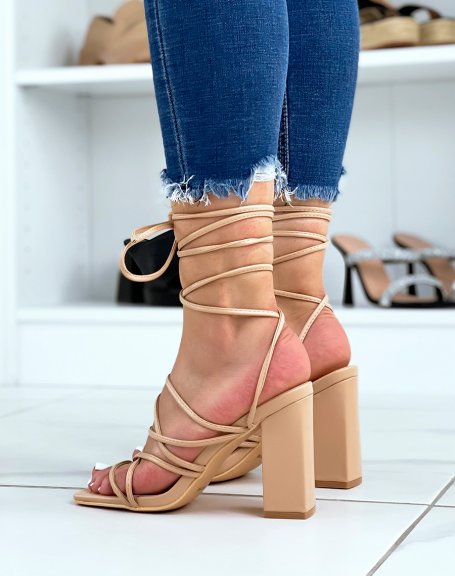 Beige sandals with criss-cross laces and high square heel