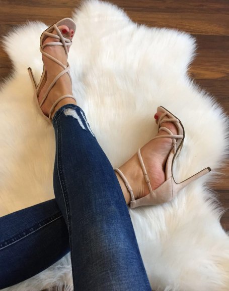 Beige sandals with crossed straps and stiletto heels