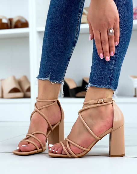 Beige sandals with intersecting straps and rounded heel