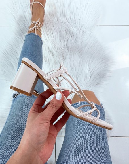 Beige sandals with low heel and multiple straps