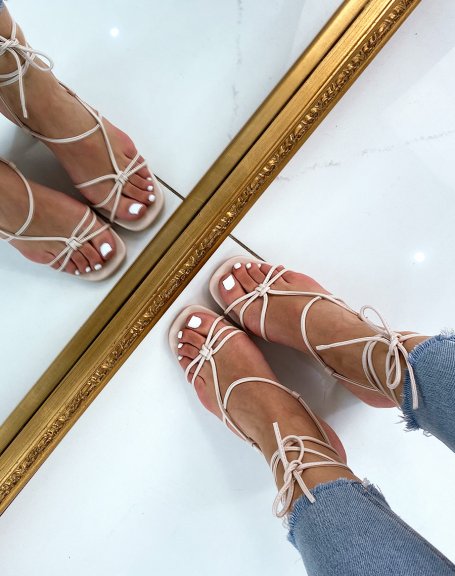 Beige sandals with low heel and multiple straps