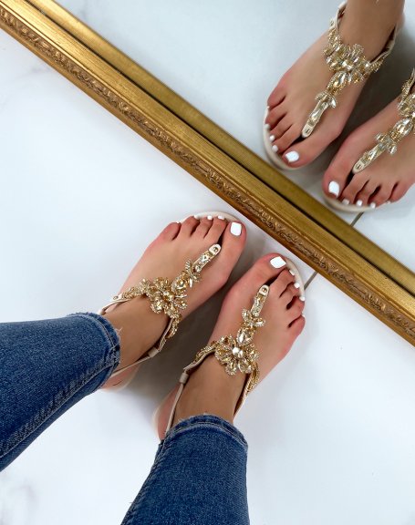 Beige sandals with multiple shiny beige and gold jewels