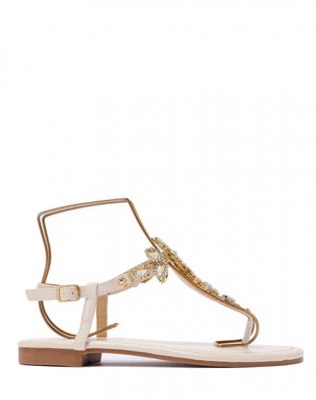 Beige sandals with multiple shiny beige and gold jewels