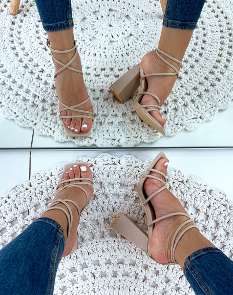 Beige sandals with square heels and thin crisscrossing straps