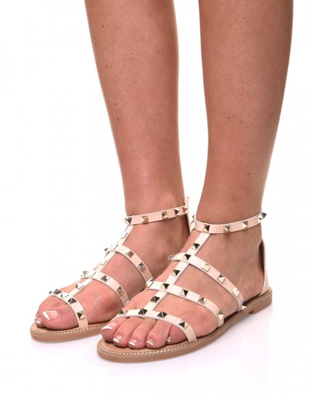 Beige sandals with studded straps