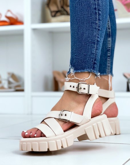 Beige sandals with thick straps and notched sole