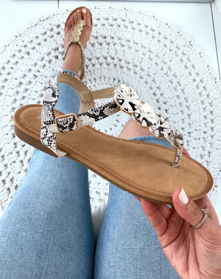 Beige snakeskin effect sandals with gold jewelry