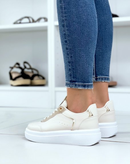 Beige sneakers with gold piping and thick white sole