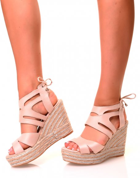 Beige suede wedge sandals with silver details and laces