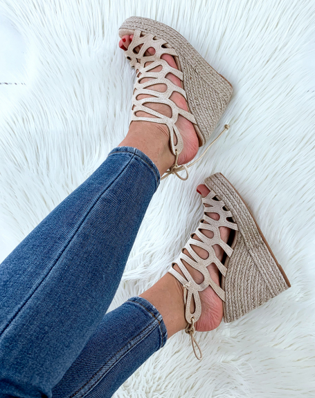 Beige suede wedges open with laces behind the ankle