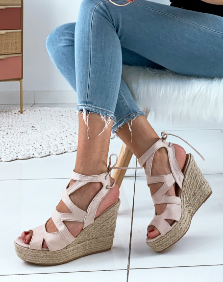 Beige suede wedges with multiple straps and laces